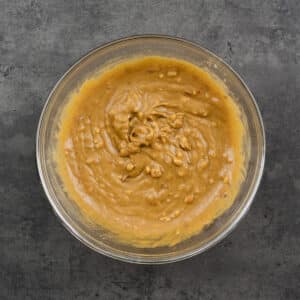 A bowl filled with perfectly whisked Thai Peanut Sauce.