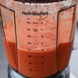 Carrot juice ingredients blending inside the blender.