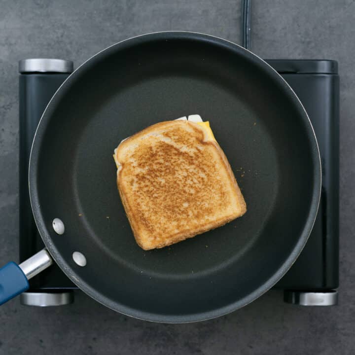 A golden toasted Grilled Cheese Sandwich on a pan.