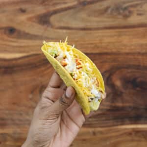 Showing chicken tacos made with hard shell taco.