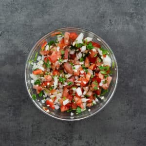 A bowl with Pico de Gallo.