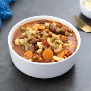 Minestrone Soup served in a white bowl.