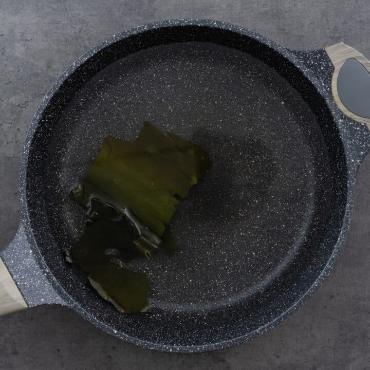 Kombu soaking in water in a pot.