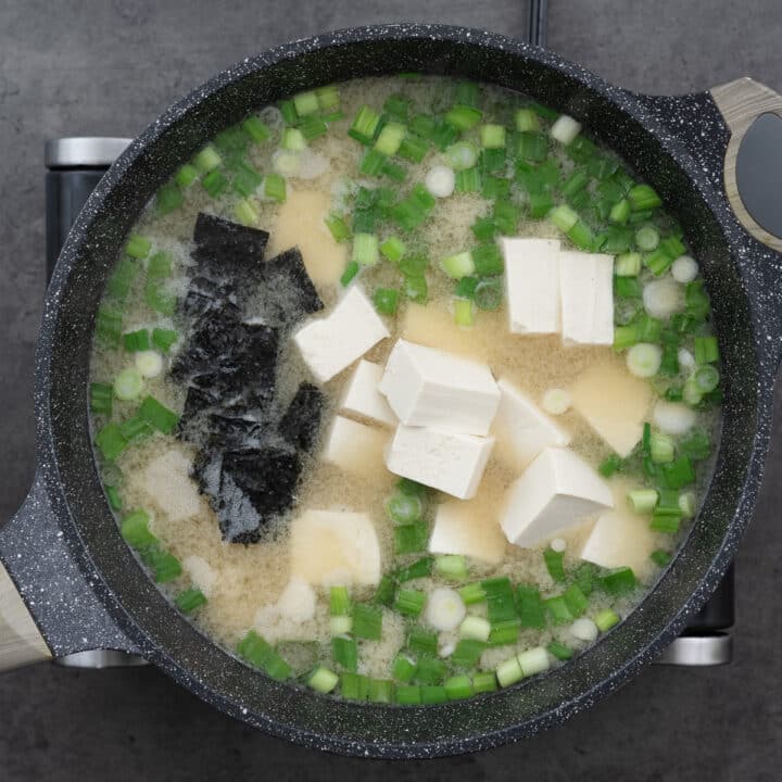 Miso Soup with seaweed and tofu in a pot.