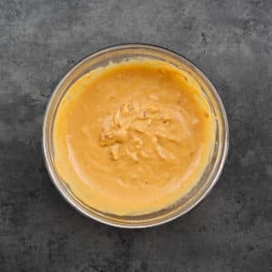 Bowl filled with creamy peanut sauce.