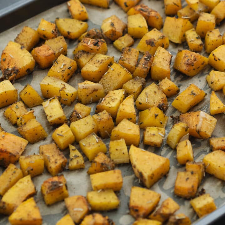 Roasted butternut squash served in a baking tray.
