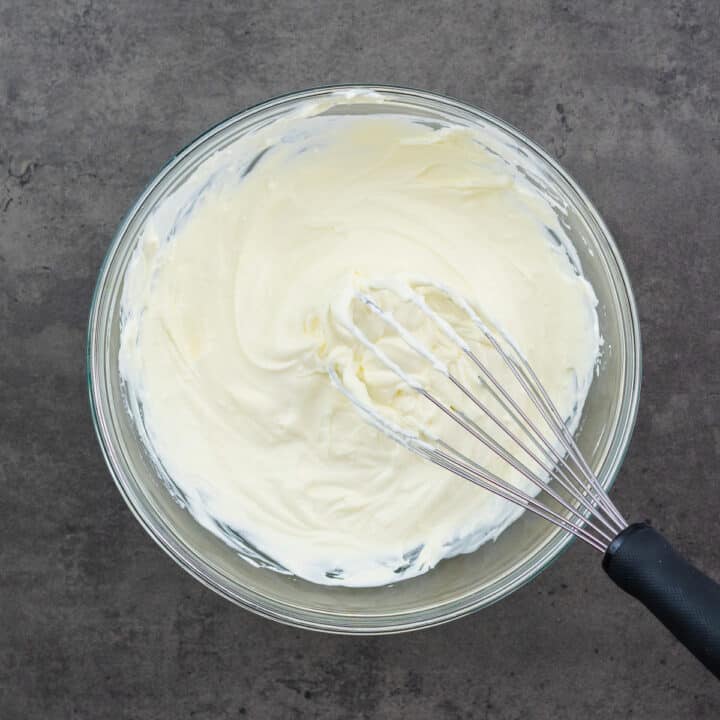 A bowl containing a creamy base made with cream cheese, mayo, and Greek yogurt.