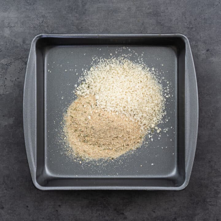 A shallow tray with breadcrumbs.