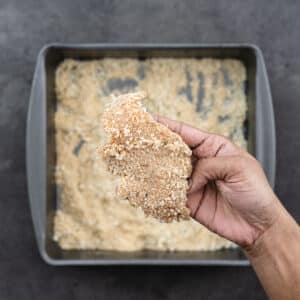 Showing a crumb-coated chicken tender.