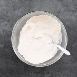 Bowl of creamy taco sauce with a spoon.