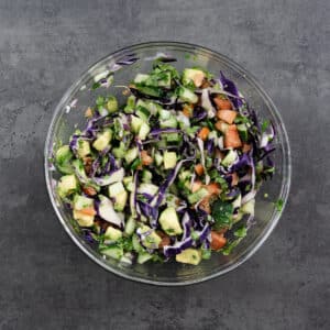 Bowl of vegetable toppings for fish tacos.