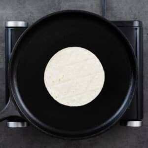 Cast iron pan with tortillas.