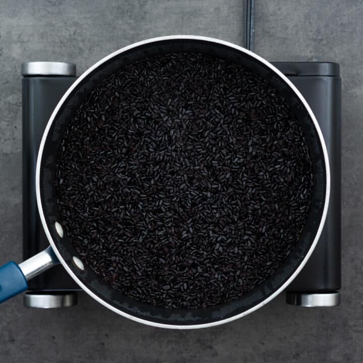 Cooked black rice in a pot.