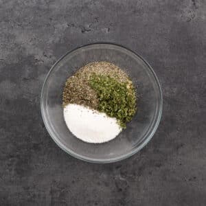 A bowl with French Fry Seasoning ingredients.