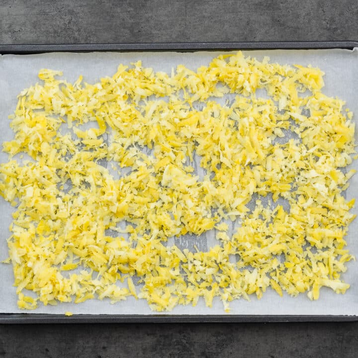 A baking tray with freshly grated lemon zest.