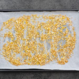 A baking tray with dried lemon zest.
