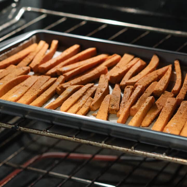 Sweet potato slices baking inside the oven.