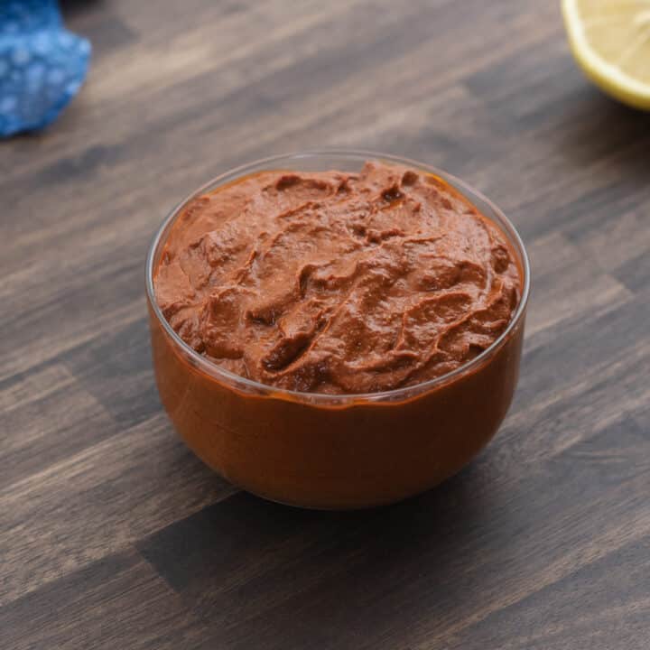 Harissa served in a black bowl.