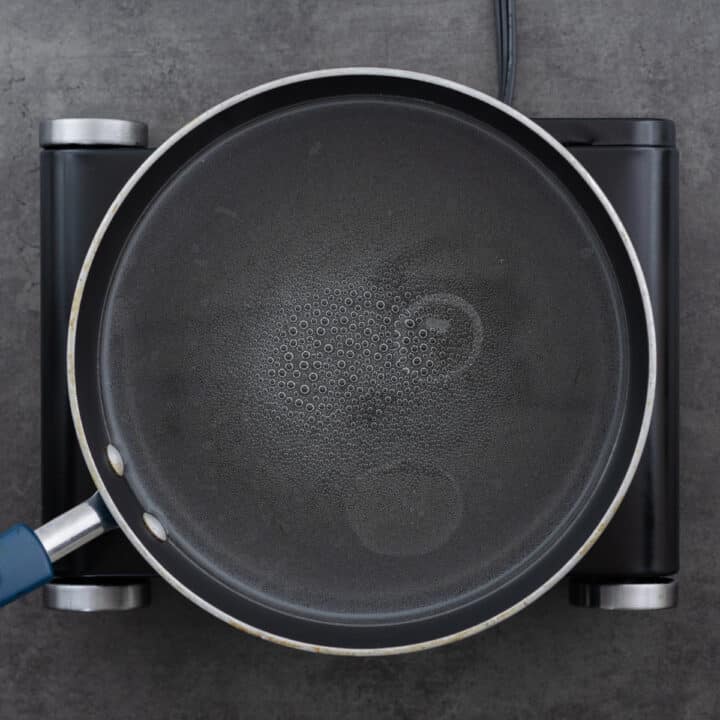 A pot filled with water that is boiling.