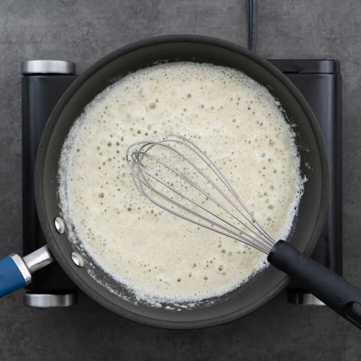 A pan with a whisked roux.