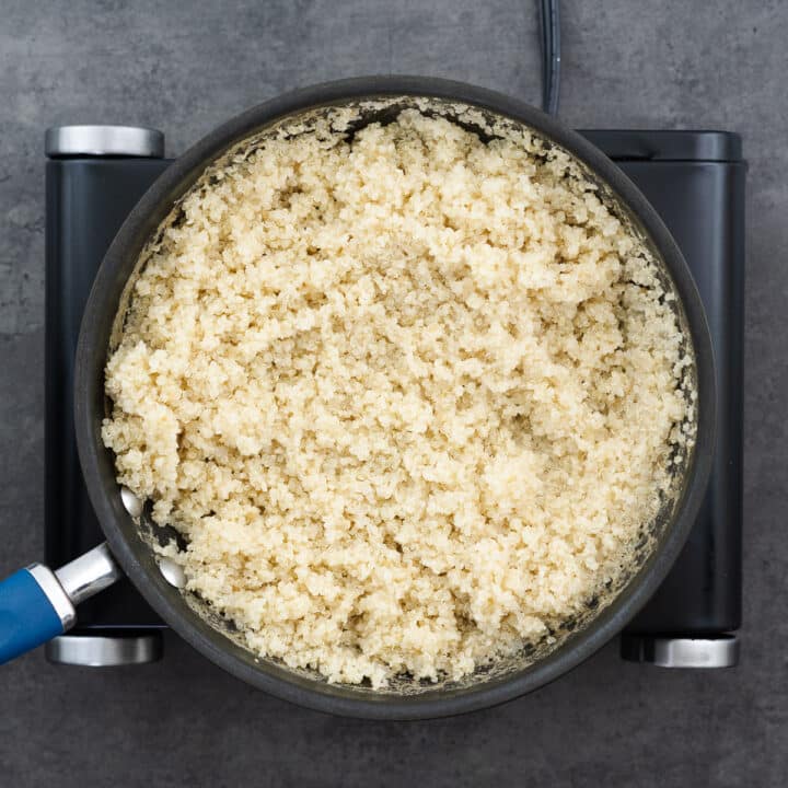 A pan with perfectly cooked quinoa, fluffed and ready.