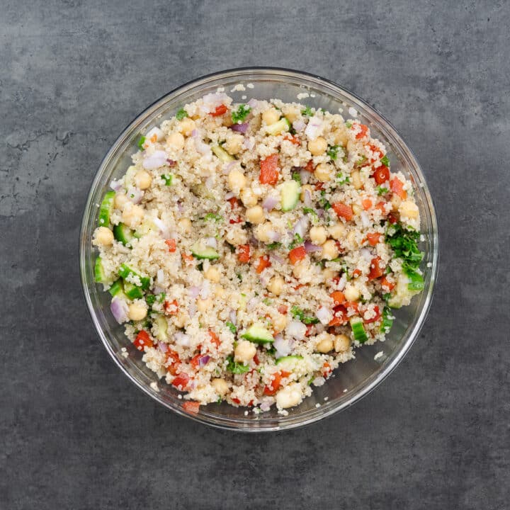 A bowl of finished quinoa salad, beautifully mixed.