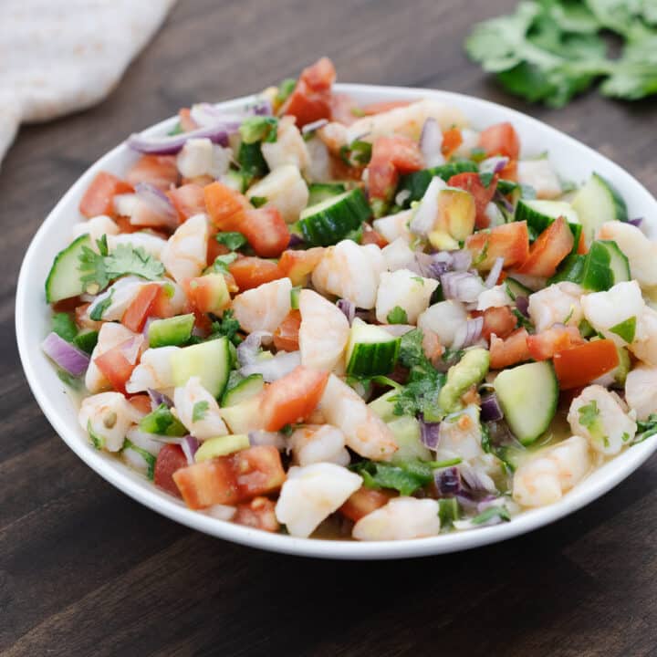 A beautifully plated serving of shrimp ceviche in a clean white bowl, ready to enjoy.