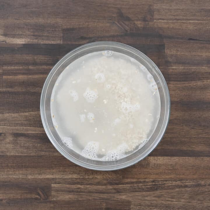 A bowl filled with barley and water, ready for rinsing.