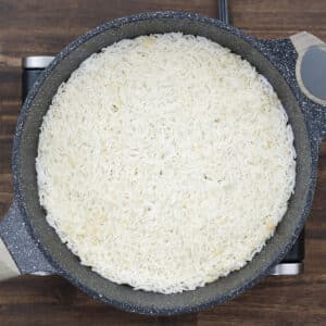 Pan showing fully cooked rice.