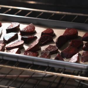 Seasoned beets roasting inside the oven.