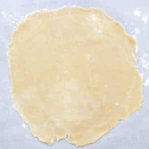Nicely rolled pie dough on parchment paper.