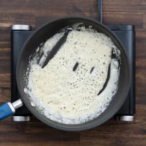 A pan showing a perfectly made roux, golden and smooth.