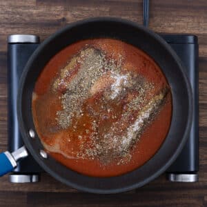 A pan with taco sauce ingredients.
