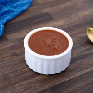 Taco sauce served in a white bowl.