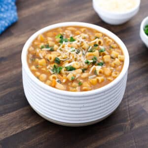 A warm bowl of pasta e fagioli soup, served in a white bowl, ready to enjoy.