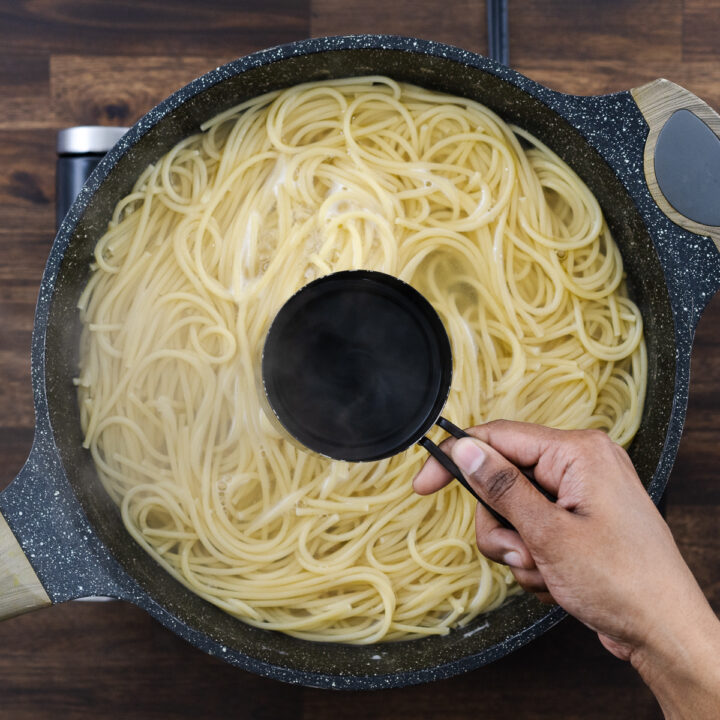 Reserving some pasta water from the pot.